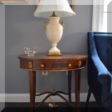 F15. 2 Maitland Smith oval banded mahogany side tables. 27”h x 27”w x 20”d - $425 each
